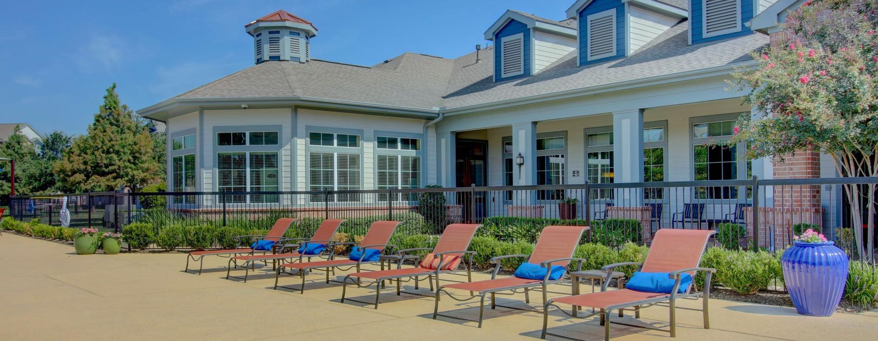 a row of lounge chairs outside