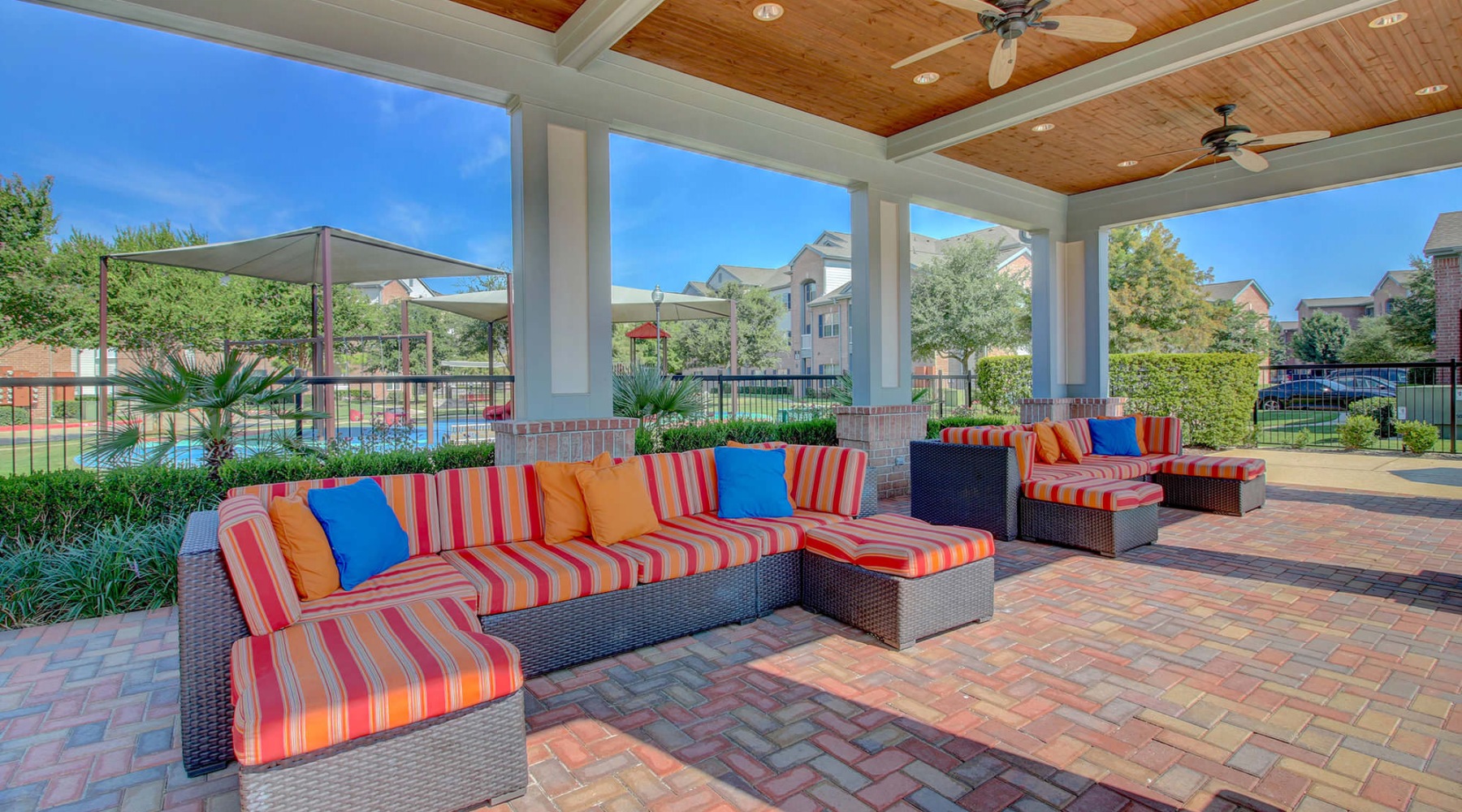 covered patio with ceiling fans